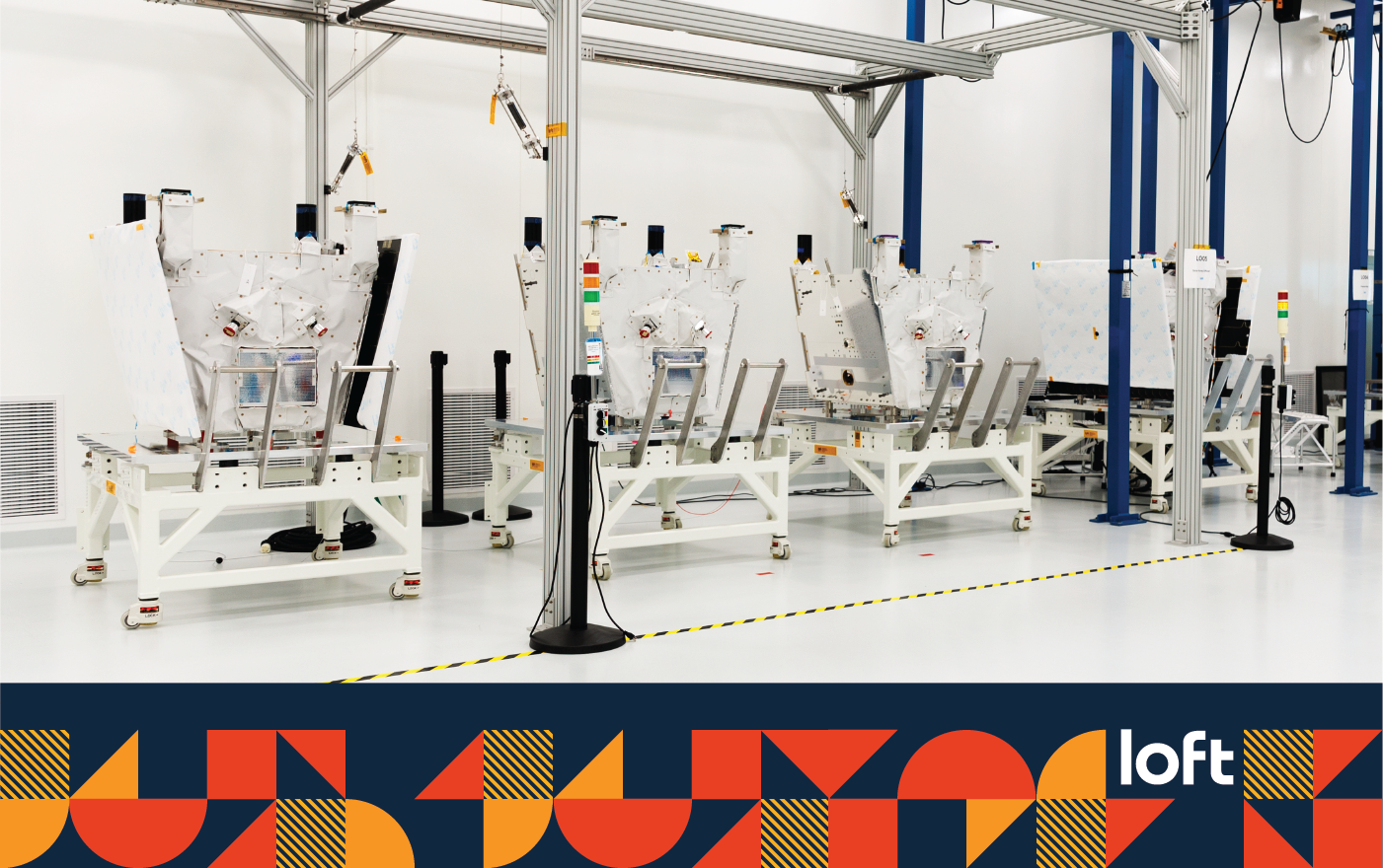 A row of satellites at Loft's Integration & Test Center.